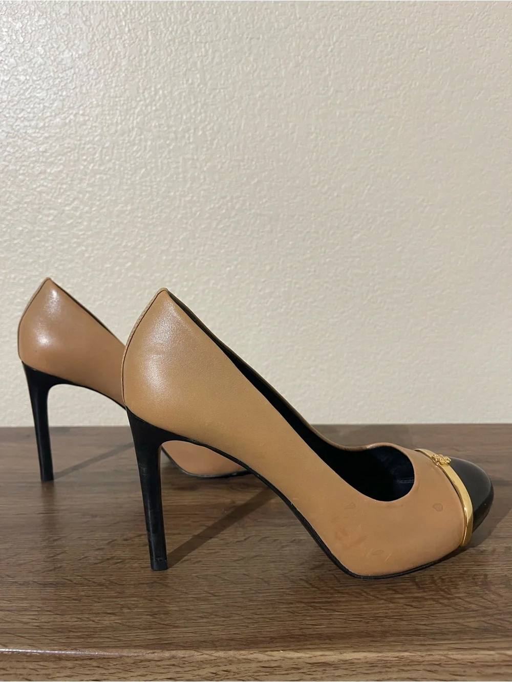 Tory Burch Two-Tone Tan and Black Cap-Toe Pumps with Gold Accent